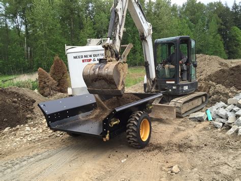 towing mini digger|mini excavator in dump trailer.